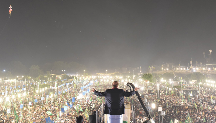Former Prime Minister and PMLN Supremo Nawaz Sharif waves to his supporters in Lahore on October 21, 2023. — X/@pmlndigitalpk