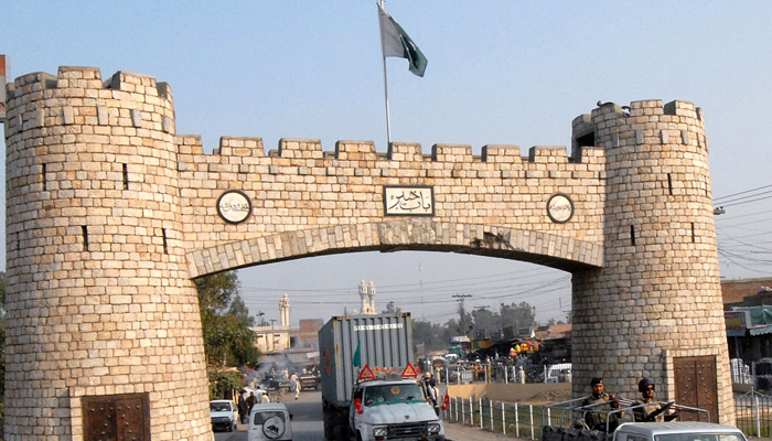 Pakistani paramilitary soldiers lead a container loaded with supplies at the Pakistani border town of Jamrud. — AFP/File