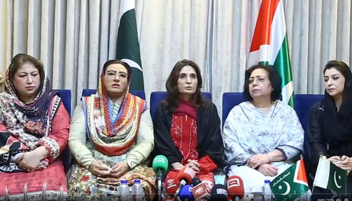 Three former PTI leaders seen seated along with IPP leader Firdous Ashiq Awan. Screengrab of a x/istehkamPK video.
