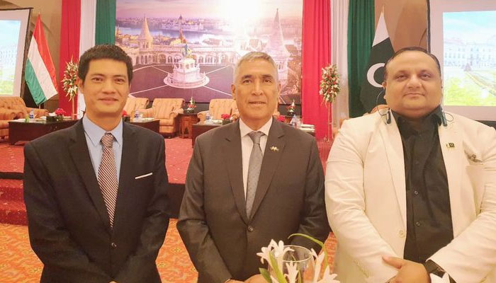 Ambassador Atadjan Movlamov of Turkmenistan (centre) stands with other officials. — Embassy of Turkmenistan
