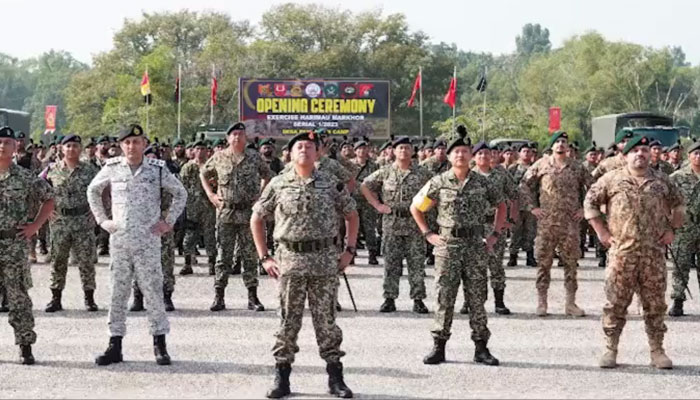Pakistani and Malaysian army personnel during the opening ceremony of the Bilateral Army Exercise Series. — X/@Pak_AfgAffairs