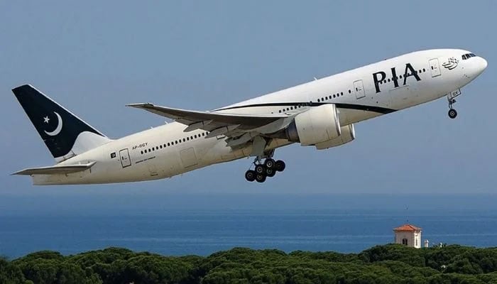 A PIA aircraft is photographed at an international destination. — PIA