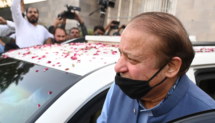 Former Prime Minister and graft convict Nawaz Sharif (R) leaves after appearing before the High Court in Islamabad on October 24, 2023. — AFP