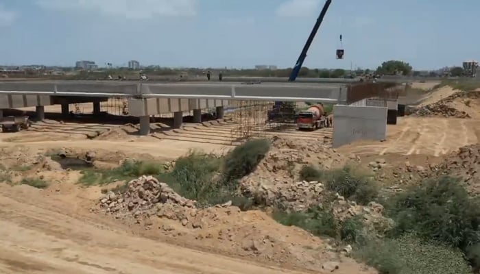 This still taken from a video released on July 5, 2023, shows an under-construction bridge under the Malir Expressway project. — X/@murtazawahab1