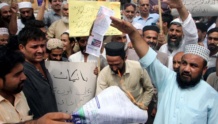 A representational image shows citizens during a protest against the highly inflated electricity bills, in Peshawar. — PPI/File