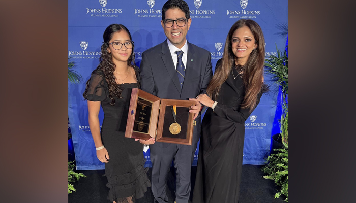 Aga Khan University (AKU) Medical College Dean Dr Adil Haider (c) posing for a picture after receiving a prestigious Johns Hopkins University Award for Distinguished Alumnus in this picture released on October  21, 2023. — Facebook/AKU Medical College, Pakistan