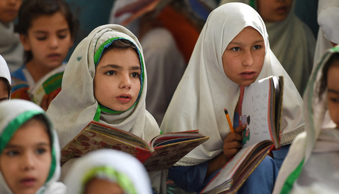 This picture shows girls attending a class in Mingora, a town in Swat Valley, Pakistan. — AFP/File