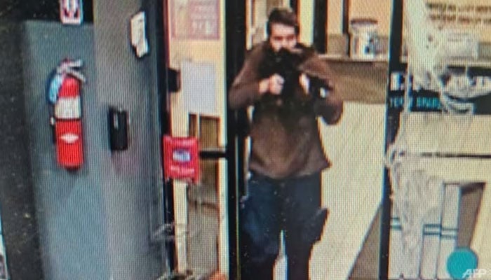 This handout image released on Oct 25, 2023 by the Androscoggin County Sheriffs Office via Facebook shows the armed suspect in a shooting in Lewiston, Maine. Androscoggin County Sheriffs Office via AFP