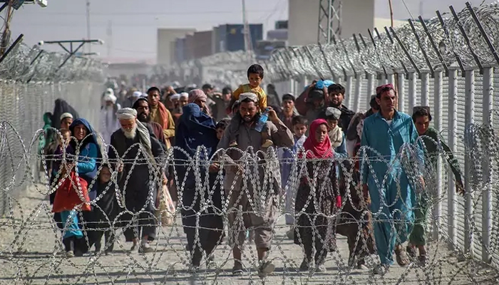 Afghans walk through an Afghanistan-Pakistan border crossing in August 2021. — AFP/File