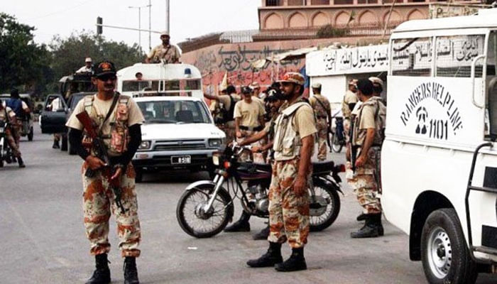 Paratroopers can be seen standing guard at a point in Karachi. The News/File
