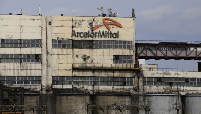 The logo of ArcelorMittal, a steel giant that entered the Kazakh market after the collapse of the Soviet Union, is seen on a mine building in the industrial town of Shakhtinsk on September 9, 2023. — AFP