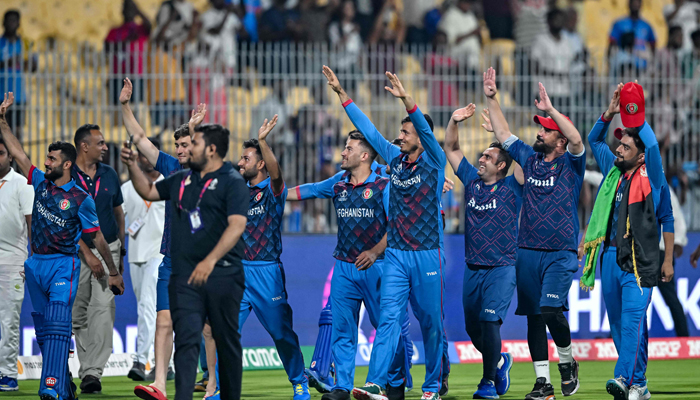 Afghanistans players greet their fans at the end of the 2023 ICC Mens Cricket World Cup ODI match between Pakistan and Afghanistan at the MA Chidambaram Stadium in Chennai on October 23, 2023. — AFP