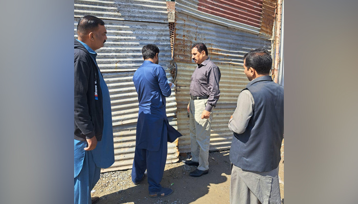 Officials of Metropolitan Corporation Lahore while sealing an illegal digging point in Lahore in this picture released on October 21, 2023. — Facebook/Metropolitan Corporation Lahore