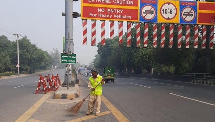 An employee of the Lahore Waste Management Company works despite the public holiday in Lahore on October 29, 2023. — Facebook/ Lahore Waste Management Company