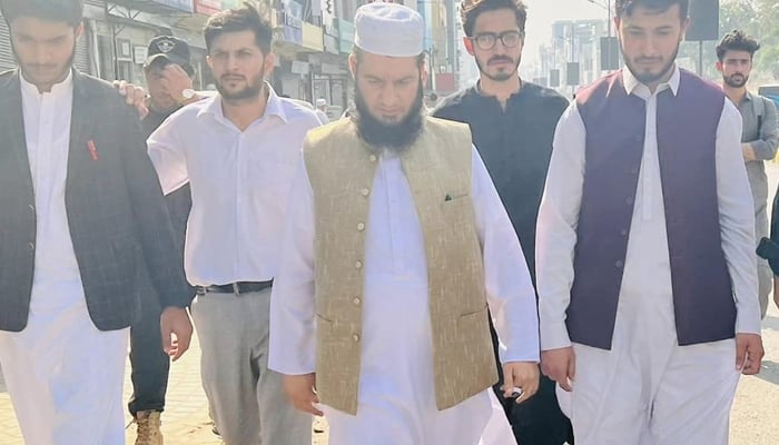 Mayor Peshawar Zubair Ali (C) walks with people in Peshawar on October 29, 2023. — Facebook/PDA-Youth Forum Pakistan