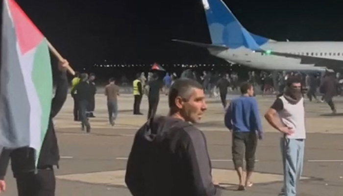This still taken from video footage posted on the Telegram channel @askrasul on October 29, 2023, shows protestors on the apron area of an airport in Makhachkala. — AFP