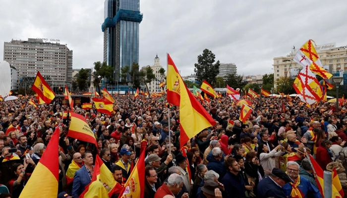 Protestors wave Spanish flags at a Madrid protest against plans to grant an amnesty to Catalan separatists on October 29, 2023. — AFP