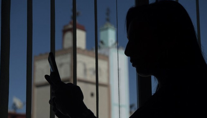 This representational image shows a person using a mobile phone. — AFP/File
