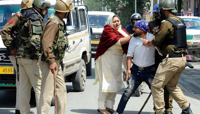 Indian security personnel detain a Kashmiri during protests in Srinagar. — AFP/File