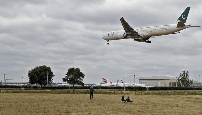 A Pakistan International Airlines Boeing 777 comes into land at Heathrow airport in west London. — AFP/File