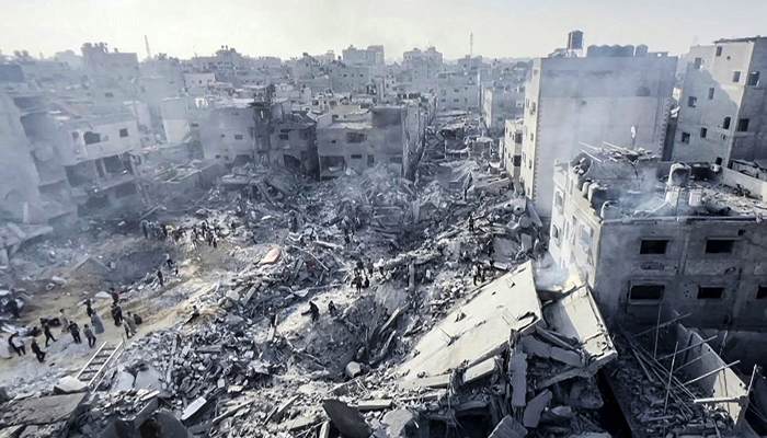 This still from AFPTV footage shows Palestinians checking the destruction in the aftermath of an Israeli strike on the Jabalia refugee camp in the Gaza Strip, on November 1, 2023. — AFP