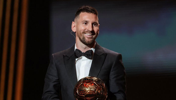 Lionel Messi receives his eighth Ballon d’Or award. — AFP