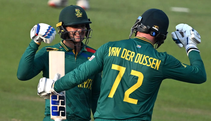 South Africas Quinton de Kock (left) celebrates with teammate Rassie van der Dussen. — AFP