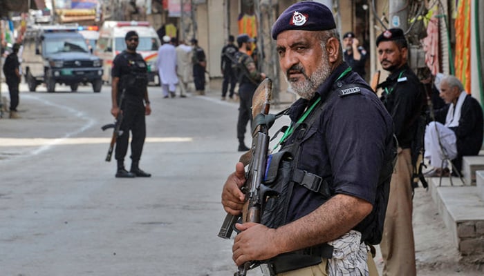 This image shows police personnel in Peshawar standing guard. — AFP/File