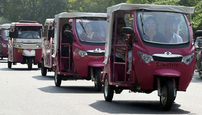 This image shows women rickshaw drivers driving a rickshaw. — AFP/File
