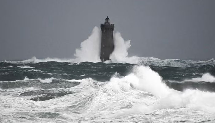 Waves crashing on the Phare du Four (Fours lighthouse) in Porspoder, western France, on 2 November 2023, as Storm Ciarán hits the region. — AFP