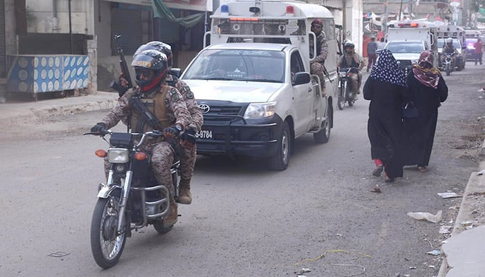 Rangers patrolling a locality in Landhi during a by-election after a firing incident on June 6, 2022. — INP