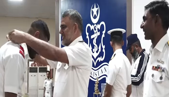 Karachi Commander Rear Admiral Muhammad Saleem gives away prizes to winners in this still taken from a video. — Facebook/DGPR Navy