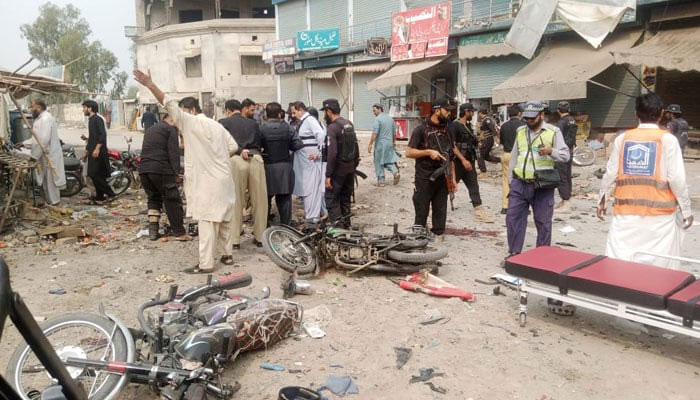 The picture shows police inspecting the area after blast in DI Khan on November 3, 2023. — The News/File