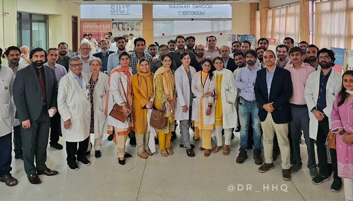 Participants and speakers during a group photo after the seminar organised by the Pakistan Society of Robotic Surgeons in collaboration with the SIUT in this image released on November 4, 2023. — Facebook/Dr. Harris Hassan Qureshi