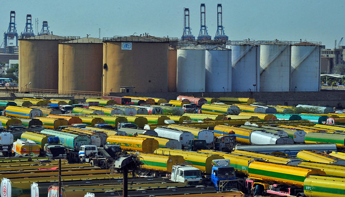 An overview shows tankers parked outside a local oil refinery in Pakistans port city of Karachi. — AFP/File