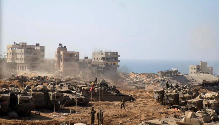 This picture on November 5, 2023, shows Israeli tanks and soldiers stationed at a location in the northern Gaza Strip as battles between Israel and the Palestinian Hamas movement continue. — AFP