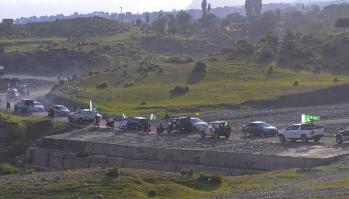 This image shows a general view of land covered with green grass in KP on August 14, 2023. — Facebook/Khyber Pakhtunkhwa Culture and Tourism Authority