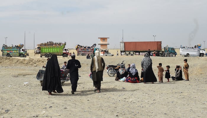 Afghan refugees arrive on trucks to cross the Pakistan-Afghanistan border in Chaman on November 7, 2023. — AFP