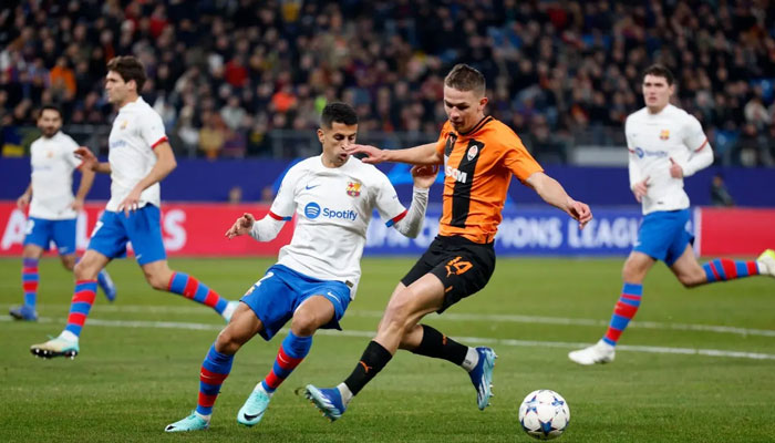 Shakhtar Donetsk’s Ukrainian forward #14 Danylo Sikan (R) and Barcelona’s Portuguese defender #02 Joao Cancelo vie for the ball during the UEFA Champions League Group H football match between FC Shakhtar Donetsk and FC Barcelona in Hamburg, northern Germany on November 7, 2023. — AFP