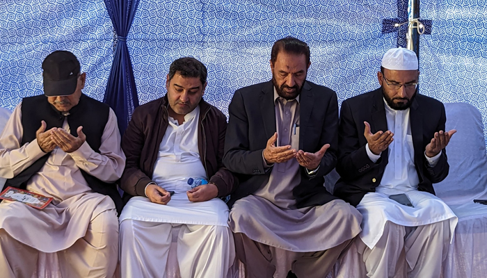 A delegation of JI visits family as can be seen praying for Lt. Col Muhammad Hassan Haider Shaheed on November 8, 2023, in Islamabad. — Facebook/Jamaat -e- Islami Pakistan
