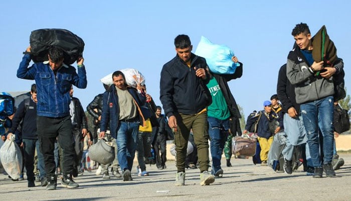 Afghan refugees are seen returning from Iran. — X/digitaljournal