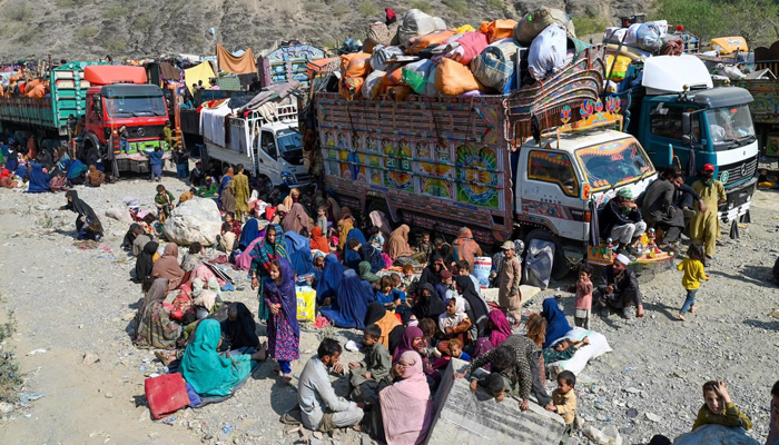 Afghan refugees arrive in trucks from Pakistan at the Afghanistan-Pakistan Torkham border in Nangarhar province on October 30, 2023. — AFP