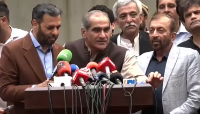 This still taken from a video released on November 8, 2023, shows PMLN leader Saad Rafique speaking with the media flanked by MQM-P leaders in Punjab. — Facebook/PML(N)