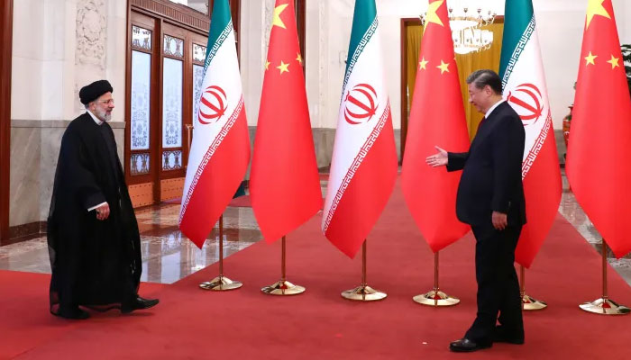 Chinas President Xi Jinping welcomes his Iranian counterpart Ebrahim Raisi in Beijing on February 14. — AFP
