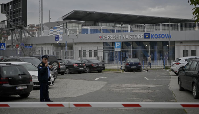 Police stand guard near the Fadil Vokrri stadium in Pristina ahead of Kosovos rearranged Euro 2024 qualifier against Israel. — AFP