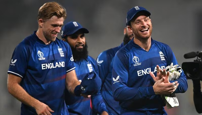 England Jos Buttler, right, leads his team off the field after victory over Pakistan. — AFP