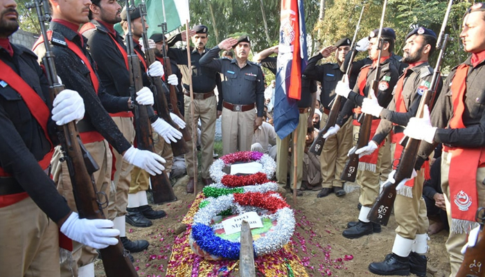 Police officials saluted the body of martyred cops on November 12, 2023. — Facebook/Khyber Pakhtunkhwa Police