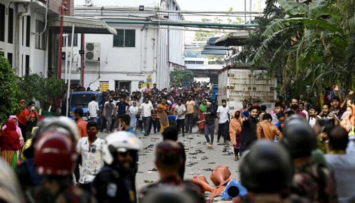 Bangladeshi garment workers clash with police during a rally in Gazipur on November 9. — AFP
