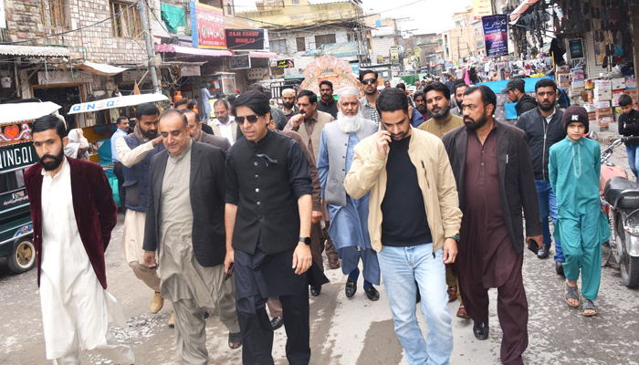 RW­MC Saqib Rafiq (c) walks during his visit to a locality in this image released on November 10, 2023. — Facebook/Rawalpindi Waste Management Company