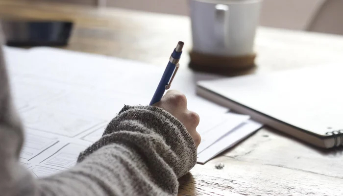 This representational photograph shows a person attempting an exam. — Unsplash/File